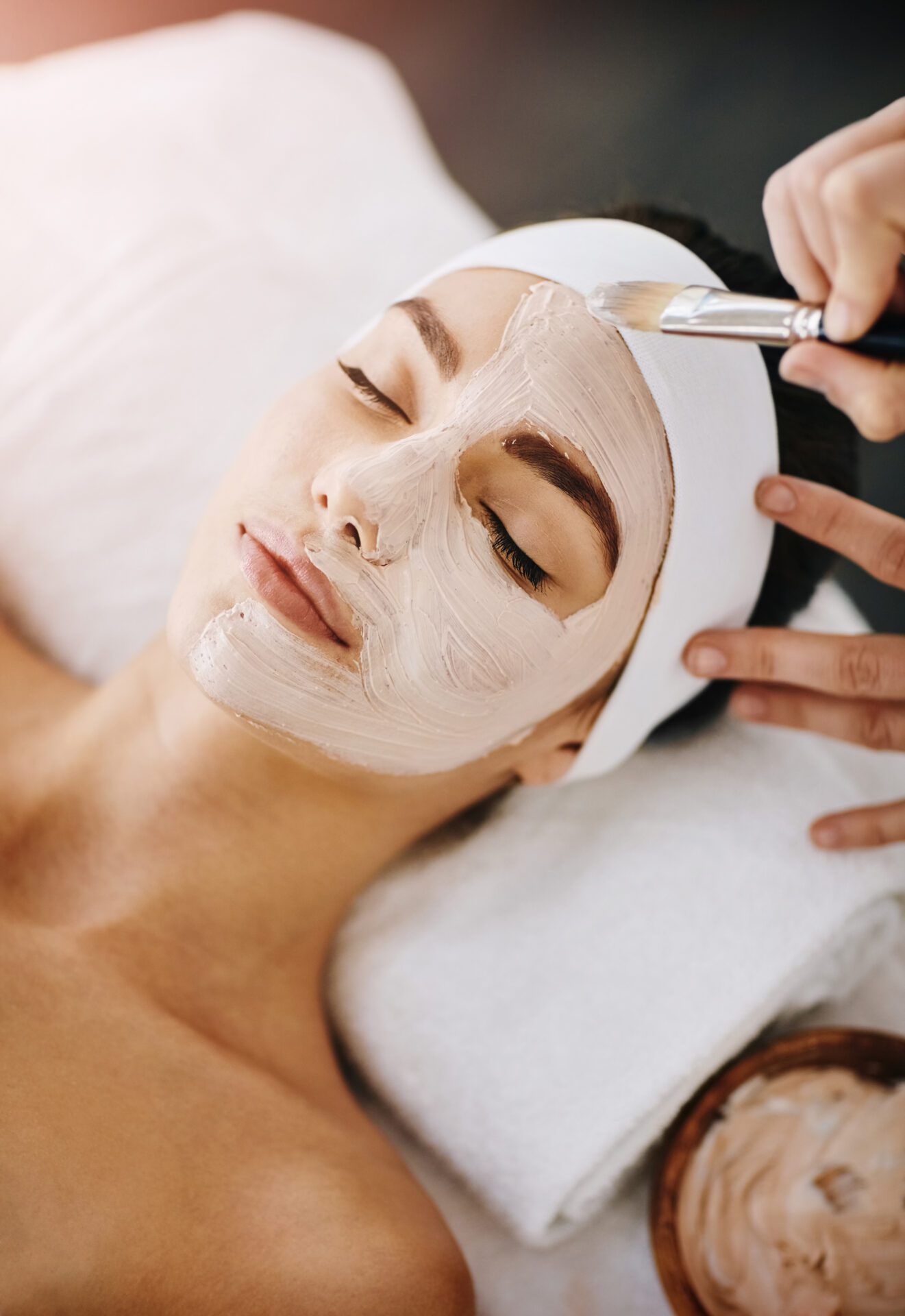 A Person Putting Eyelash Extension on the Client 