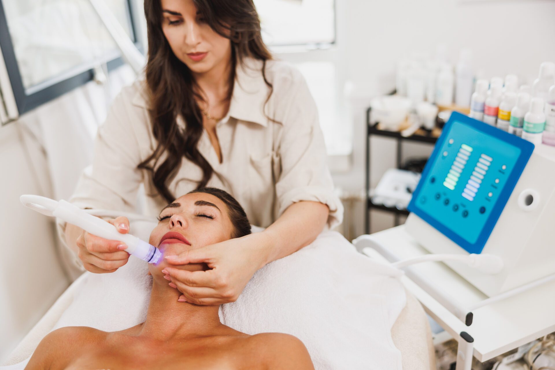 A Person Putting Eyelash Extension on the Client 