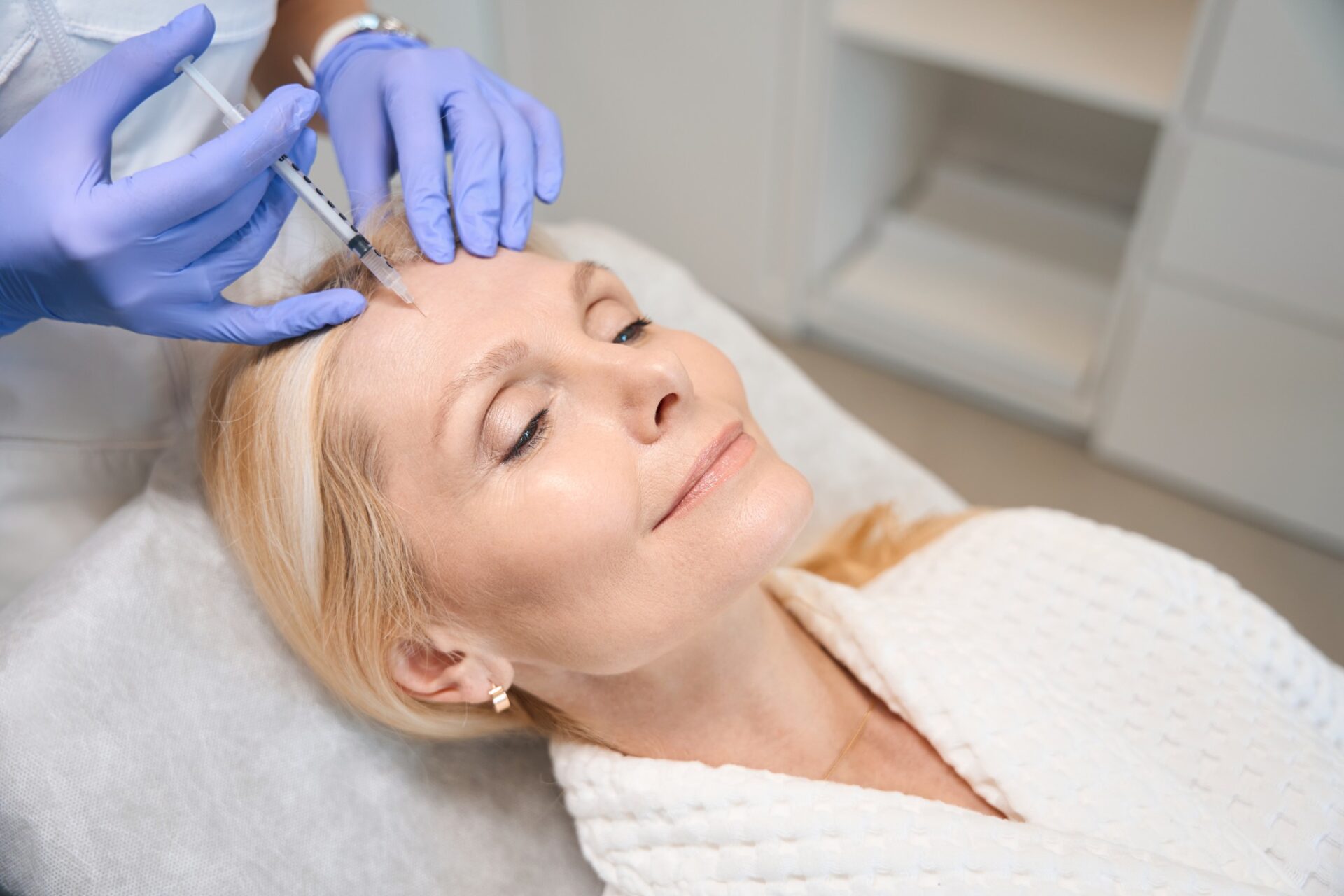 Woman receiving facial injection at med spa